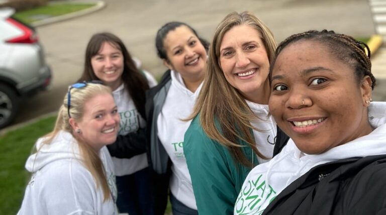 A group of 5 women standing outside the capitol building in Olympia, WA
