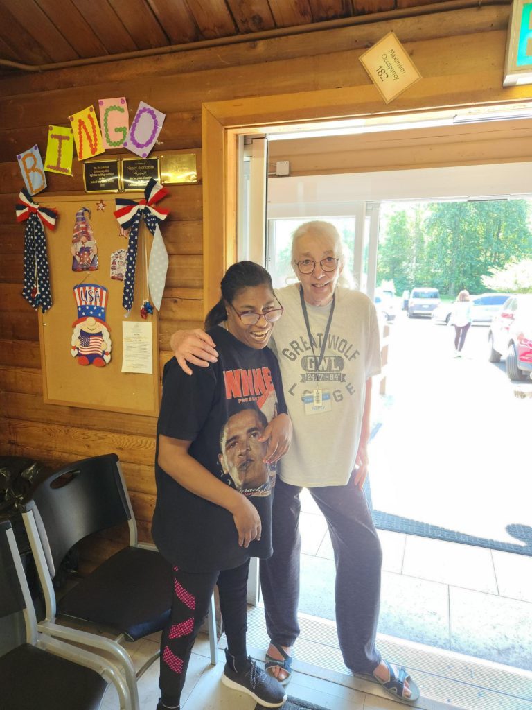 Two ladies, hanging out together at the Bingo hall