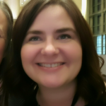 A woman with medium length brown hair is smiling. This is Stephanie, the Training Coordinator at TLC.